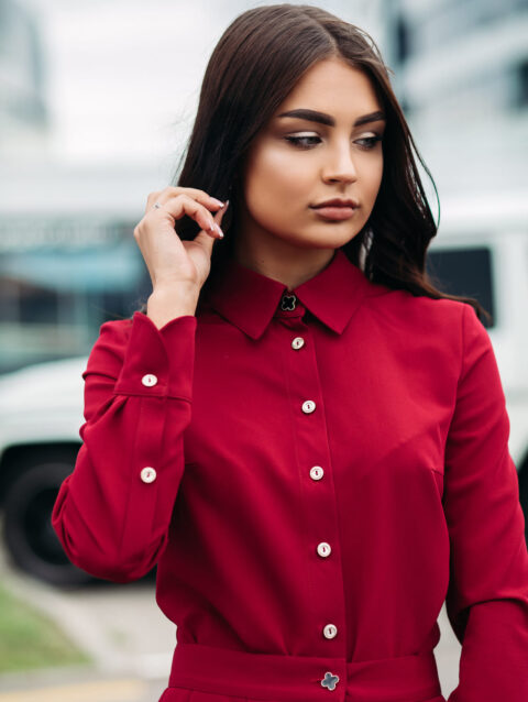 woman with make up in red buttoned up dress 2025 02 12 03 51 39 utc